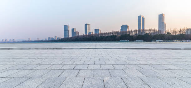 istock Panoramic skyline and modern business office buildings with empty road,empty concrete square floor 971268164