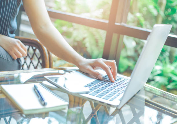 istock Woman hands working with laptop computer in  the office. 971275936