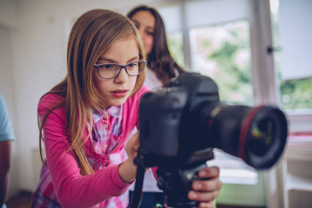 istock Young girl photographer 971276038