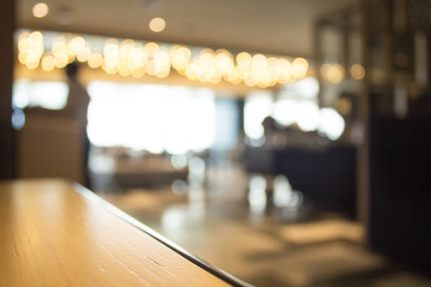 istock Blurred interior design with bright white lighting and hanging lights in cafe or restaurant. 971278332