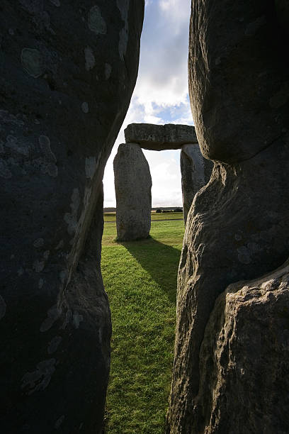 Peering through Stonehenge stock photo