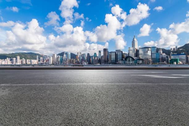 istock Panoramic skyline and modern business office buildings with empty road,empty concrete square floor 971283934