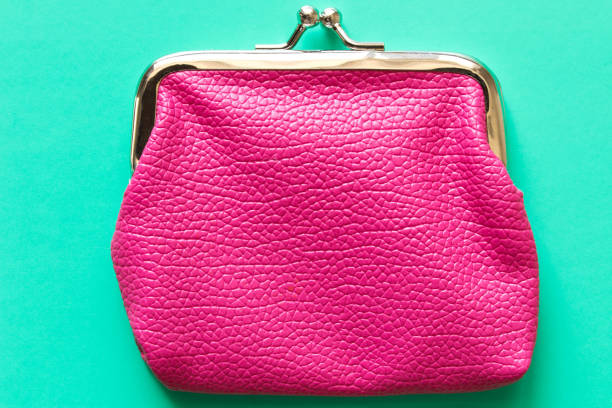 istock Pink wallet on turquoise background . Close up. Top view 971283988