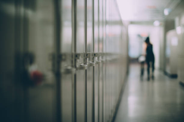Lockers in a Hallway Closed lockers in a school hallway locker stock pictures, royalty-free photos & images