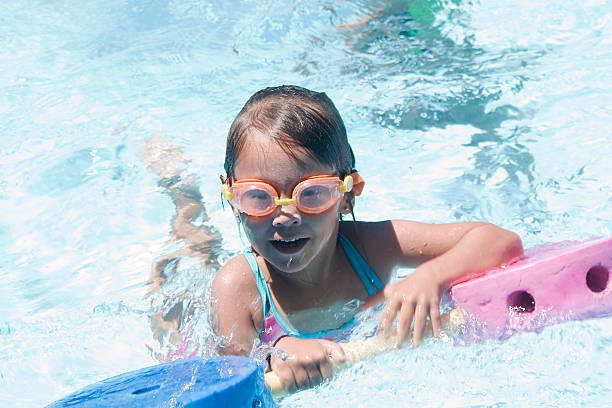 istock Girl learning to swim 97128907