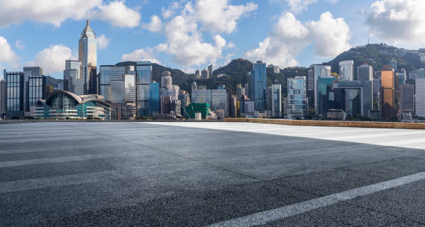 istock Panoramic skyline and modern business office buildings with empty road,empty concrete square floor 971289332