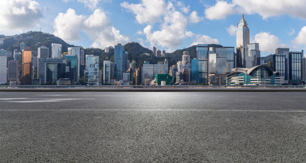 istock Panoramic skyline and modern business office buildings with empty road,empty concrete square floor 971289920