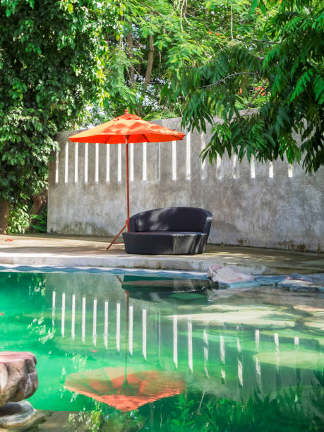 istock Pool chair and parasol 971292266