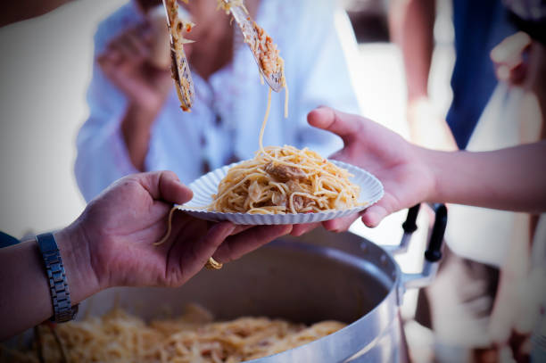 istock Feeding the poor to alleviate hunger. give concept 971292398