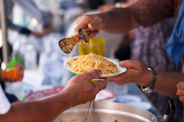 istock Feeding the poor to alleviate hunger. give concept 971292556