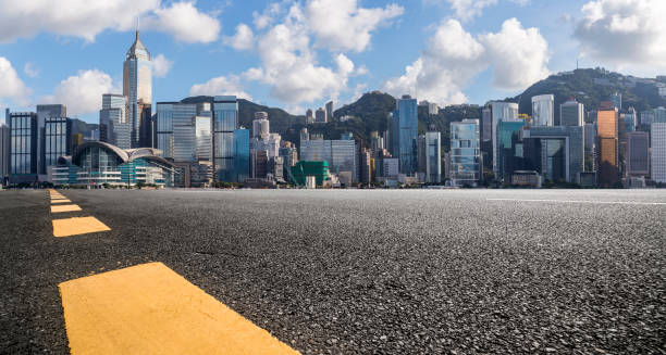 istock Panoramic skyline and modern business office buildings with empty road,empty concrete square floor 971292594