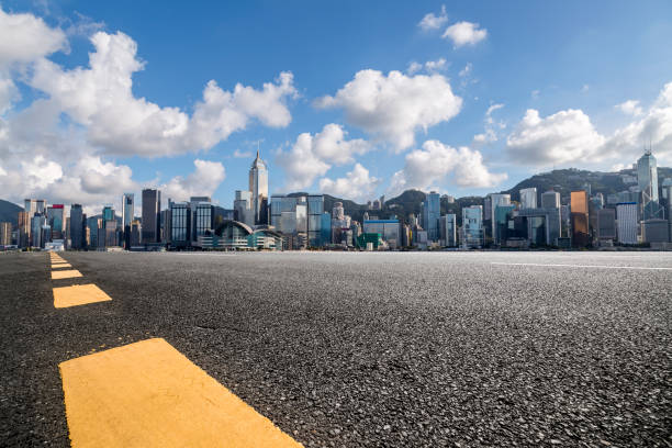 istock Panoramic skyline and modern business office buildings with empty road,empty concrete square floor 971293014