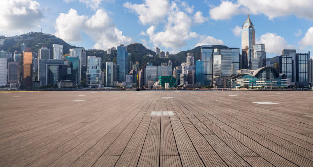 istock Panoramic skyline and modern business office buildings with empty road,empty concrete square floor 971293254