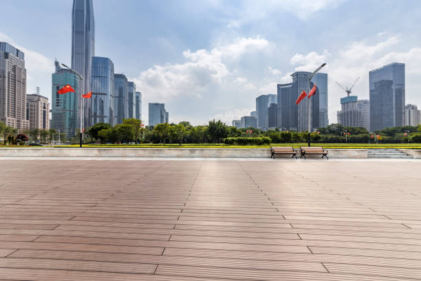 istock Panoramic skyline and modern business office buildings with empty road,empty concrete square floor 971298520