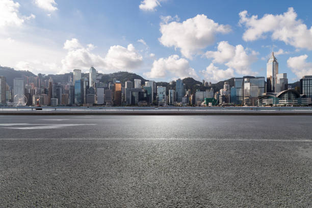 istock Panoramic skyline and modern business office buildings with empty road,empty concrete square floor 971298730