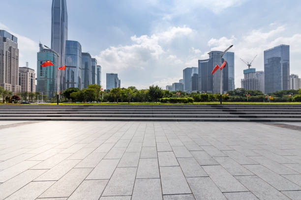 istock Panoramic skyline and modern business office buildings with empty road,empty concrete square floor 971298732