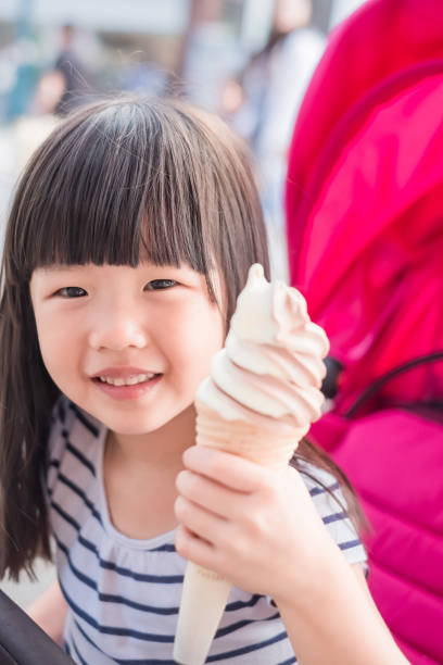 istock cute girl eat icecream 971301002