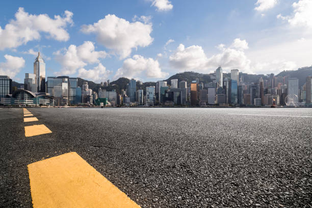 istock Panoramic skyline and modern business office buildings with empty road,empty concrete square floor 971301018