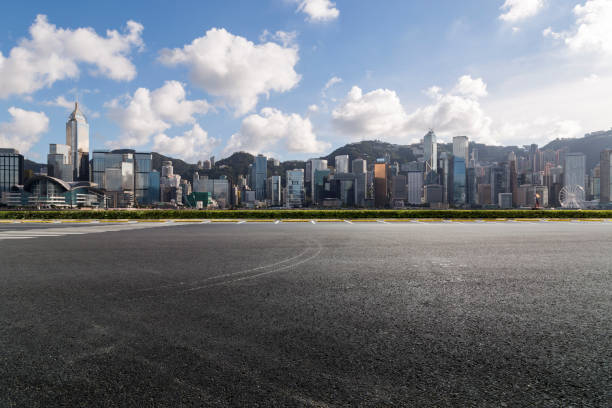 istock Panoramic skyline and modern business office buildings with empty road,empty concrete square floor 971304410