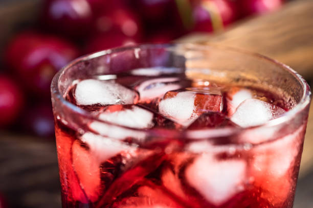 istock Fresh cherries ice cubes and cherry juice on wood 971304540