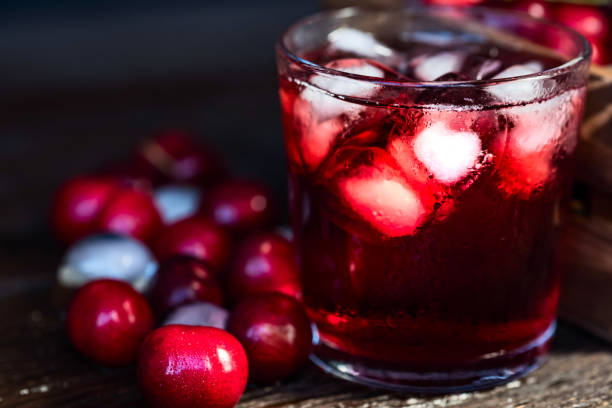 istock Fresh cherries ice cubes and cherry juice on wood 971304618