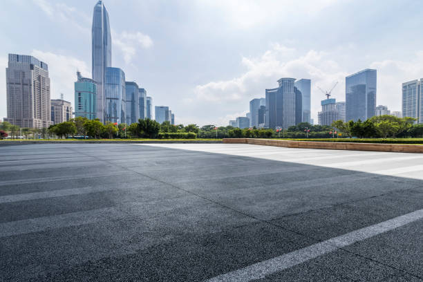 istock Panoramic skyline and modern business office buildings with empty road,empty concrete square floor 971319172