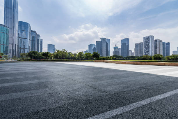 istock Panoramic skyline and modern business office buildings with empty road,empty concrete square floor 971324764