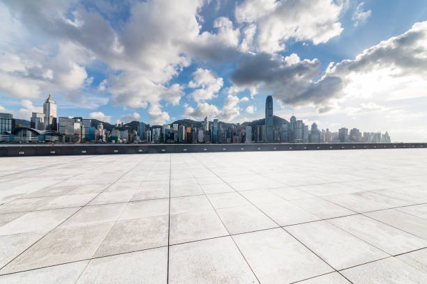 istock Panoramic skyline and modern business office buildings with empty road,empty concrete square floor 971325922