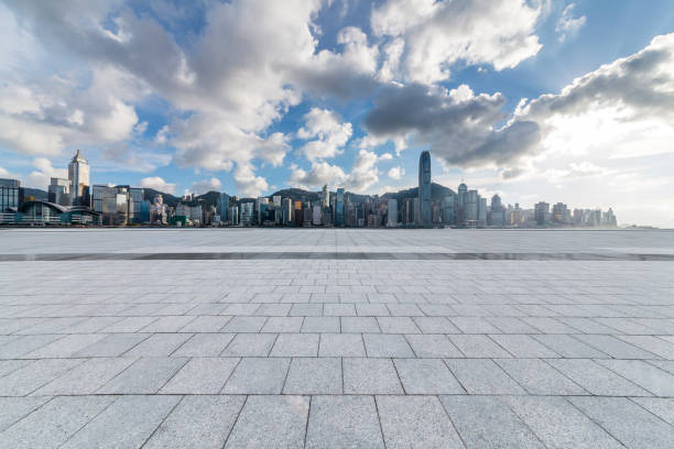 istock Panoramic skyline and modern business office buildings with empty road,empty concrete square floor 971328572