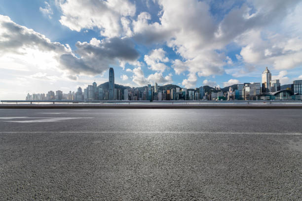 istock Panoramic skyline and modern business office buildings with empty road,empty concrete square floor 971328682