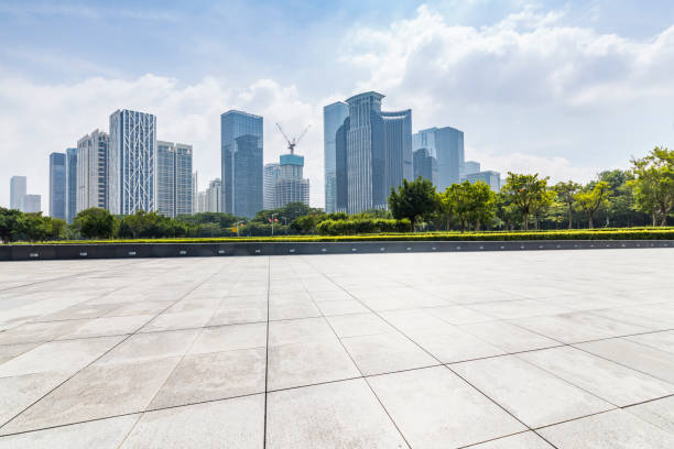 istock Panoramic skyline and modern business office buildings with empty road,empty concrete square floor 971332312