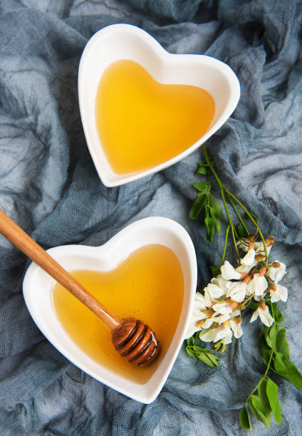 istock Honey with acacia blossoms 971335034