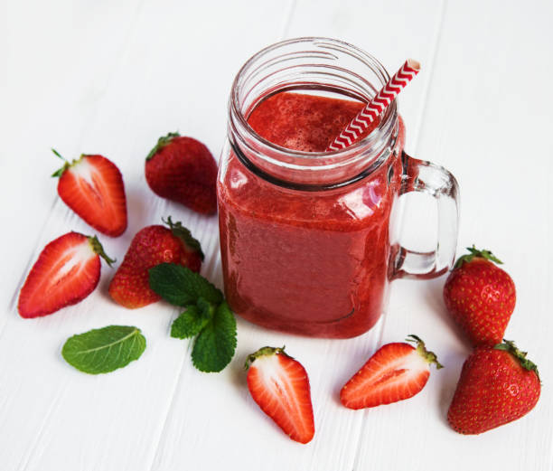 istock Jar with strawberry smoothie 971335042