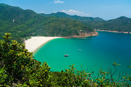 The clear turquoise waters of a secluded Hong Kong beach is the perfect vacation getaway