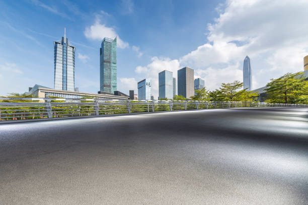 istock Panoramic skyline and modern business office buildings with empty road,empty concrete square floor 971338106