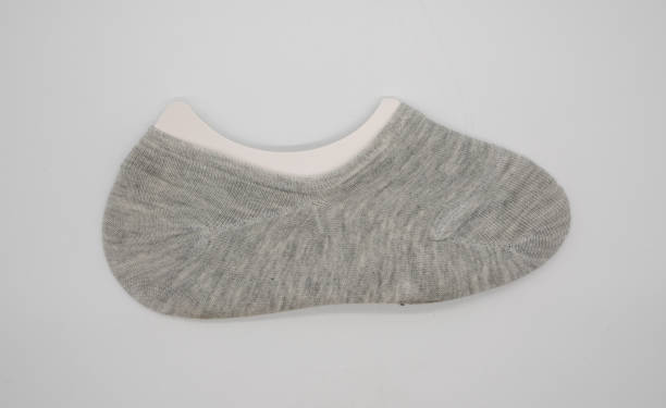 Thin grey fabric invisible lady shoe socks isolated on white background