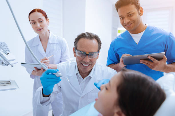 istock Scared girl looking at her doctor 971346910