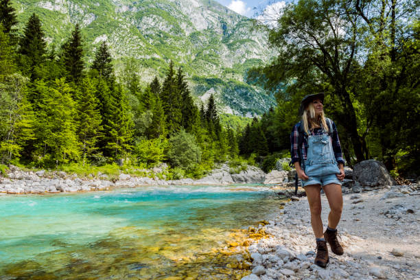 The young woman enjoys the river Soča, Trenta valley, Primorska, Slovenia, Europe The young woman enjoys the river Soča, Trenta valley, Primorska, Slovenia, Europe,no logos,Nikon D850 soca valley stock pictures, royalty-free photos & images