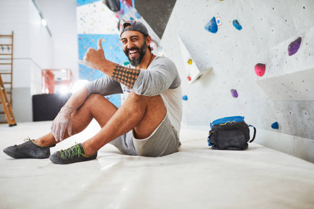 Indoor wall climbing and bouldering extreme sports.Made in Barcelona indoor climbing gym with expert climbers.