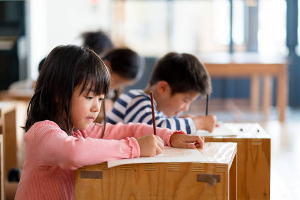 Young group of students in an arts and crafts class Young group of students in an arts and crafts class. Okayama, Japan japanese boy and girl stock pictures, royalty-free photos & images