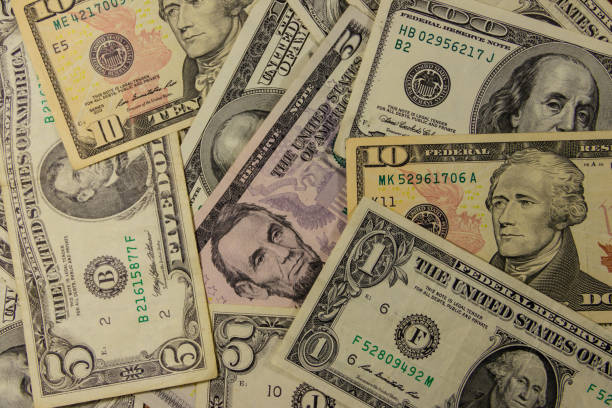 istock Background of different dollar banknotes 971360652
