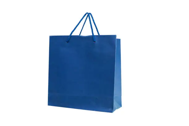 Photo of mockup of red paper shopping bag with handles