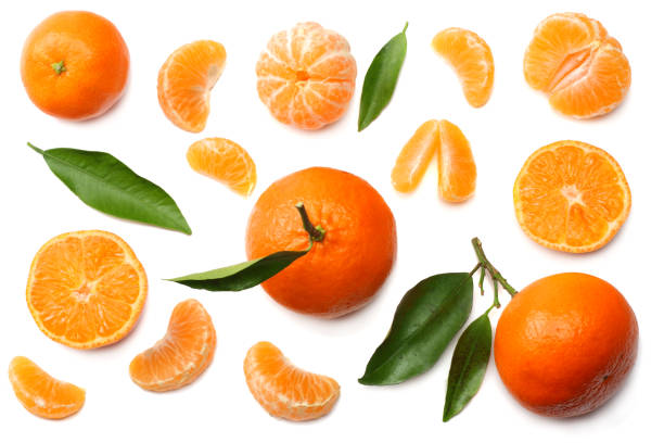 istock mandarin with slices and green leaf isolated on white background top view 971366290