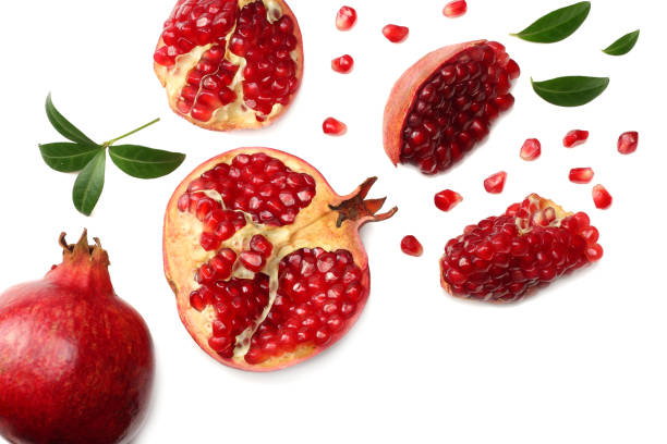 istock pomegranate fruit with green leaves isolated on a white background top view 971366348