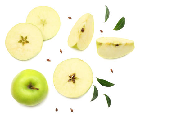 istock green apples with slices isolated on white background. top view 971366394