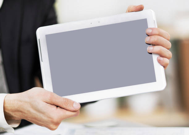 istock Businessman hands are holding the touch screen device 971366750