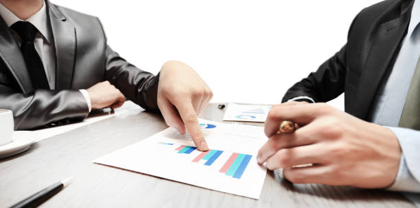 istock work of two young businessmen using touchpad at meeting 971369812