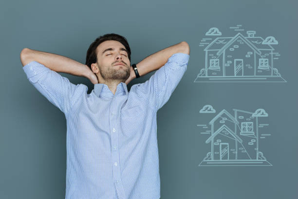 istock Calm student relaxing and dreaming about buying a house 971369898