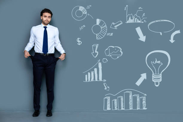 istock Poor businessman showing empty pockets after losing money 971370390
