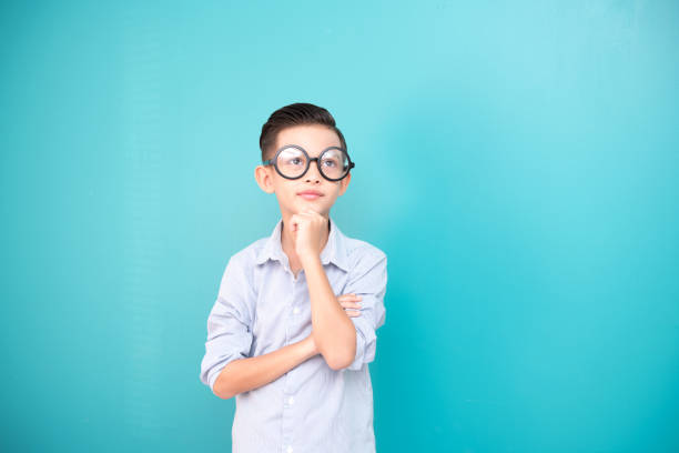 istock Young boy wearing a large glasses. 971370638